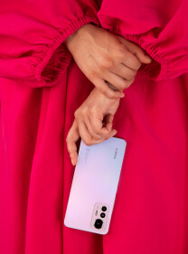 A girl holding a phone close up.